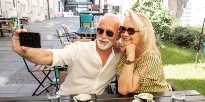 Happy senior couple embracing outdoors